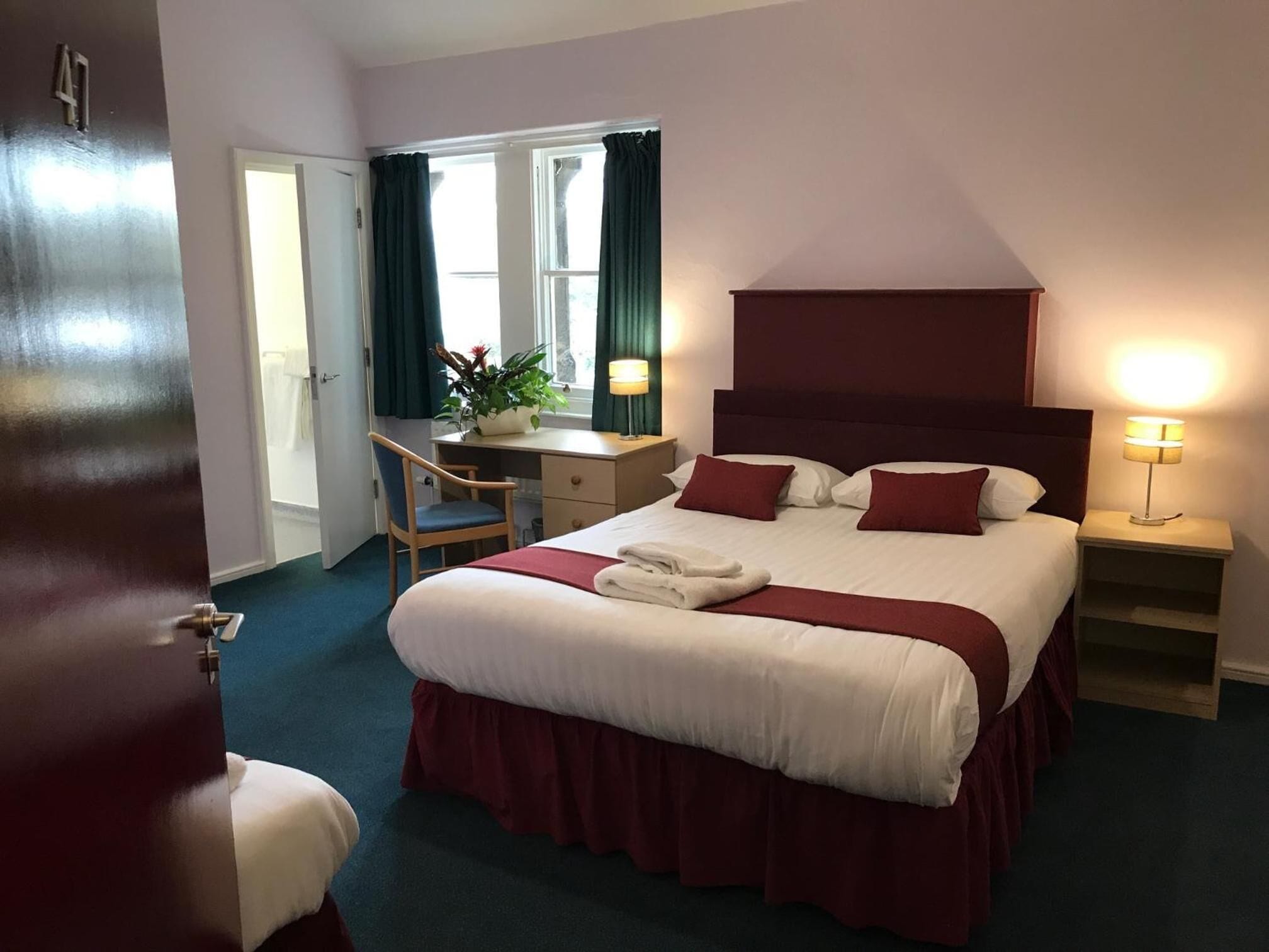 family triple room, multiple beds, garden view | desk, iron/ironing board, free wifi, bed sheets