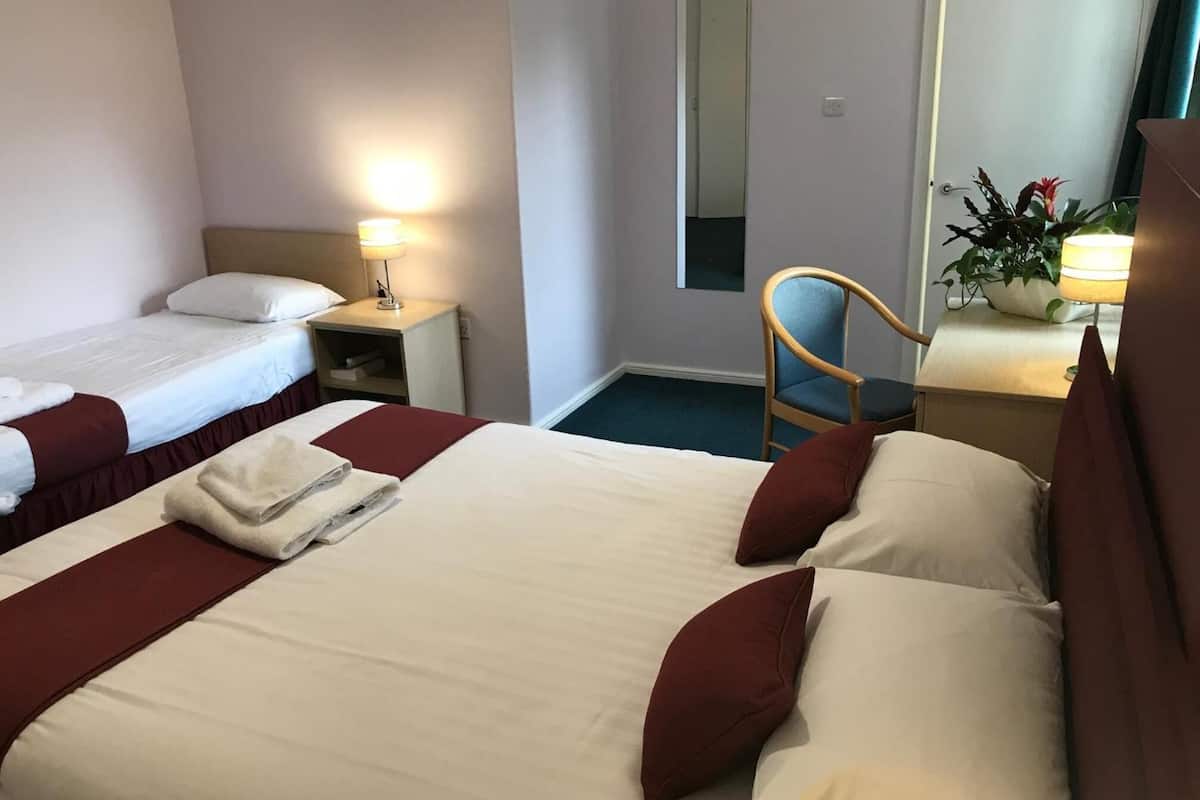 family triple room, multiple beds, garden view | desk, iron/ironing board, free wifi, bed sheets