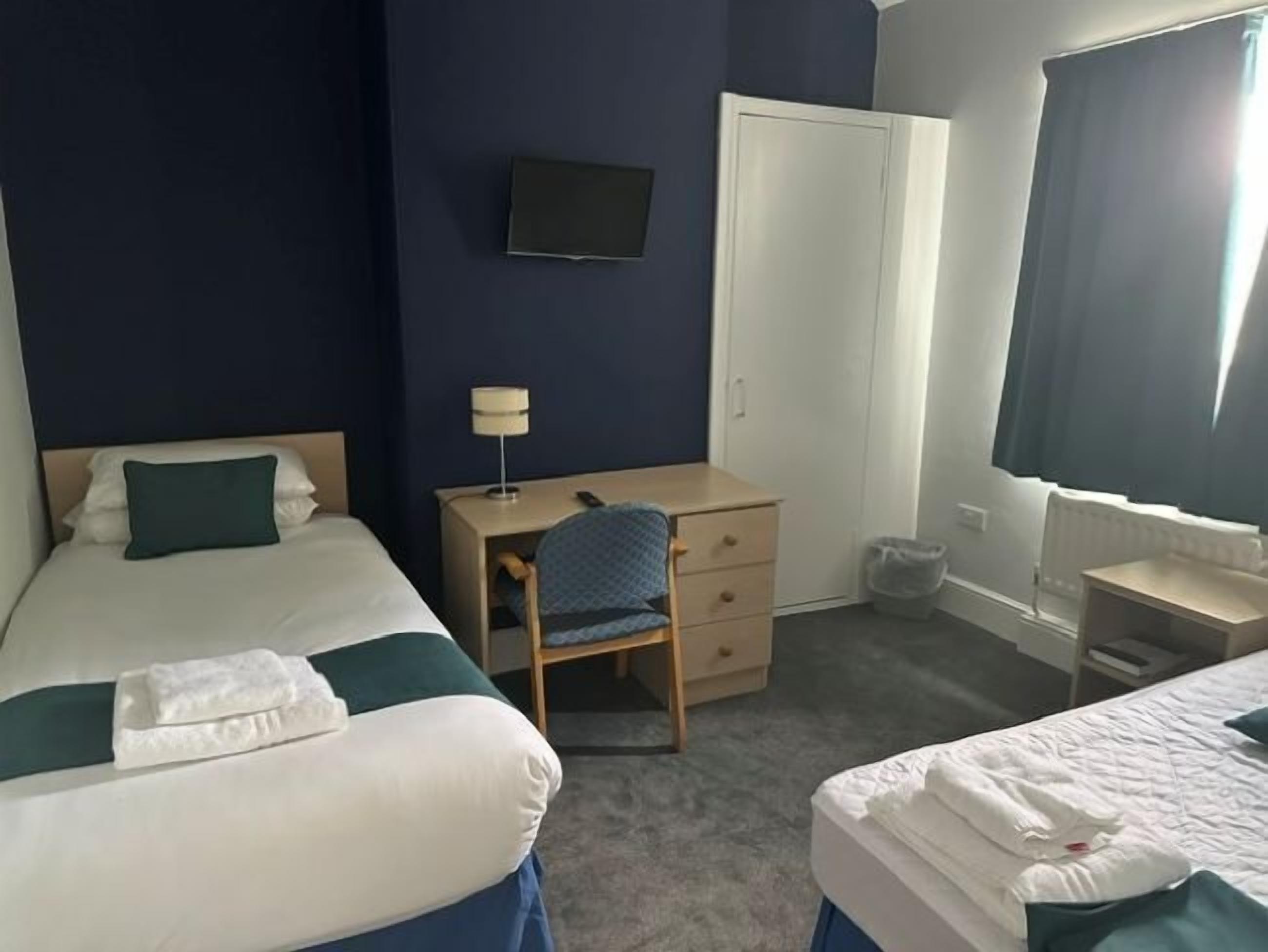 Family Quadruple Room | Desk, iron/ironing board, free WiFi, bed sheets
