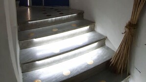 A staircase with a view of a mountain and water. - Don Carlo Rooms (Naples)