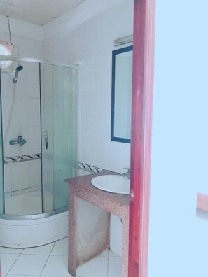 Shower, free toiletries, hair dryer, slippers