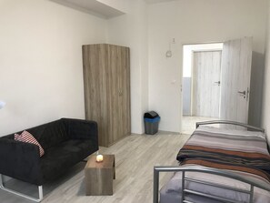 Habitación individual | Cortinas opacas, tabla de planchar con plancha, wifi gratis