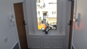 A hotel entrance with a view of the street outside, including a building labeled "The White House." - Your Oxford Stay (Oxford)