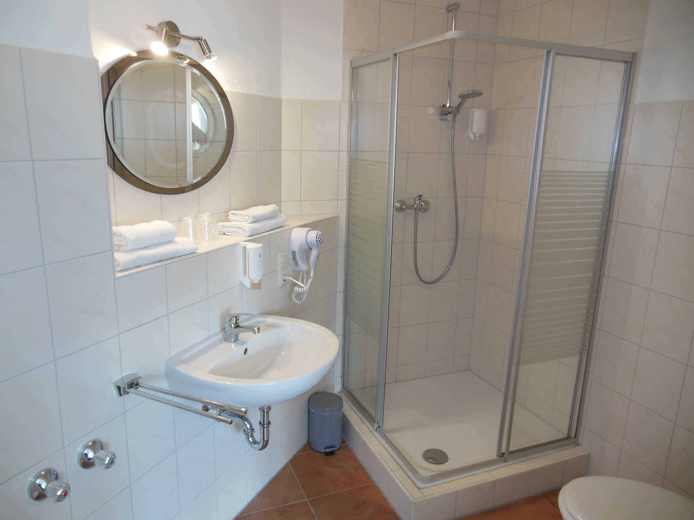 deluxe apartment | bathroom | deep-soaking bathtub, free toiletries, hair dryer, towels