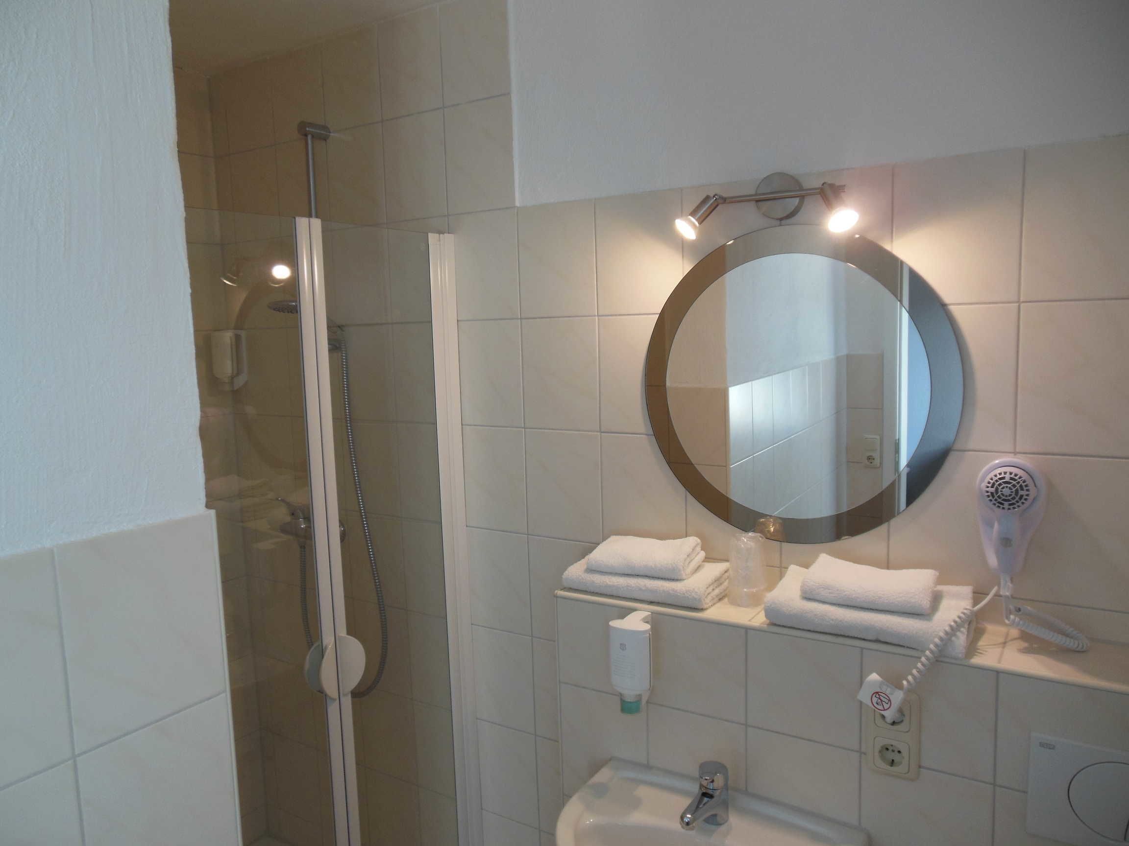 deep-soaking bathtub, free toiletries, hair dryer, towels