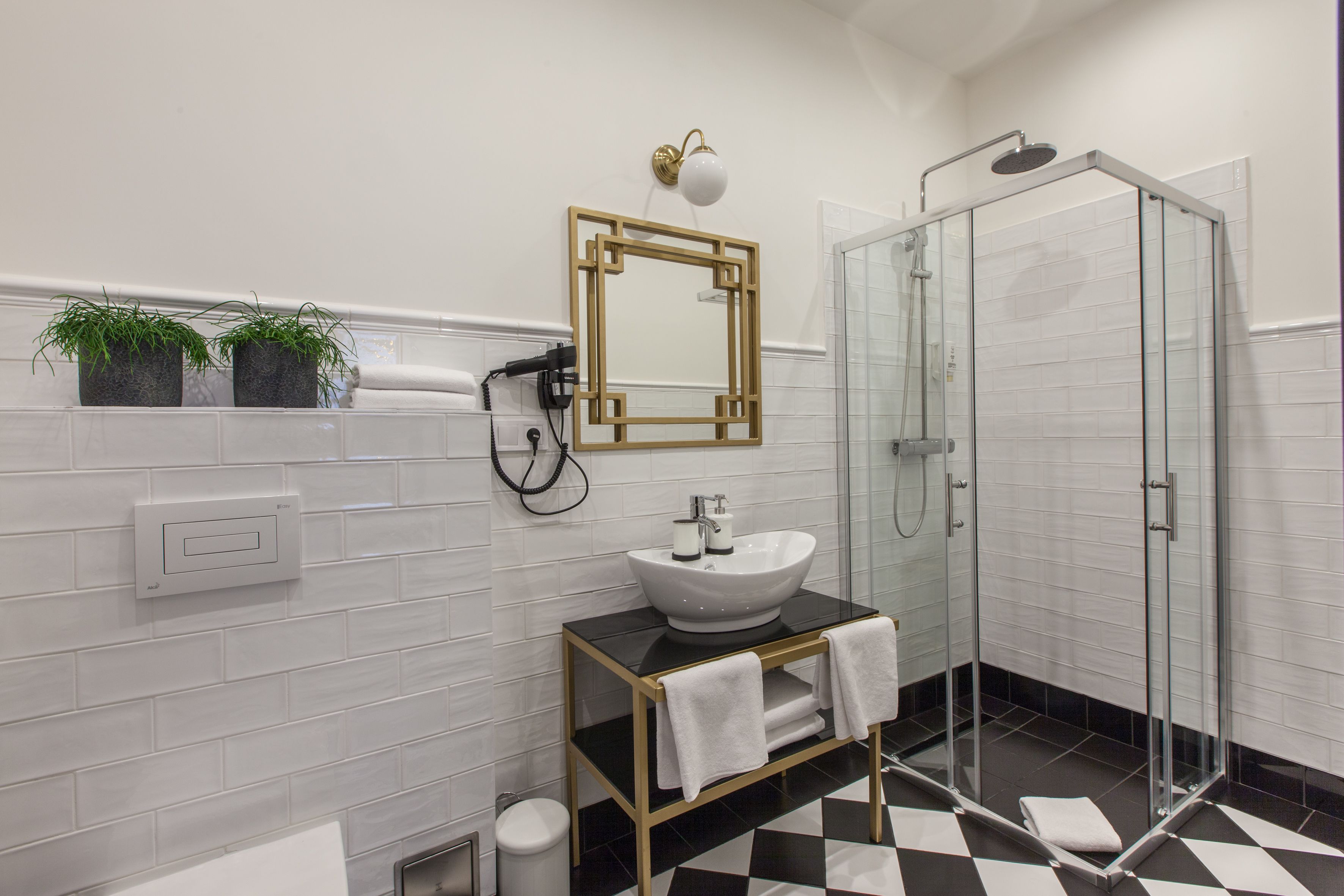 deluxe quadruple room (family) | bathroom | shower, free toiletries, hair dryer, slippers