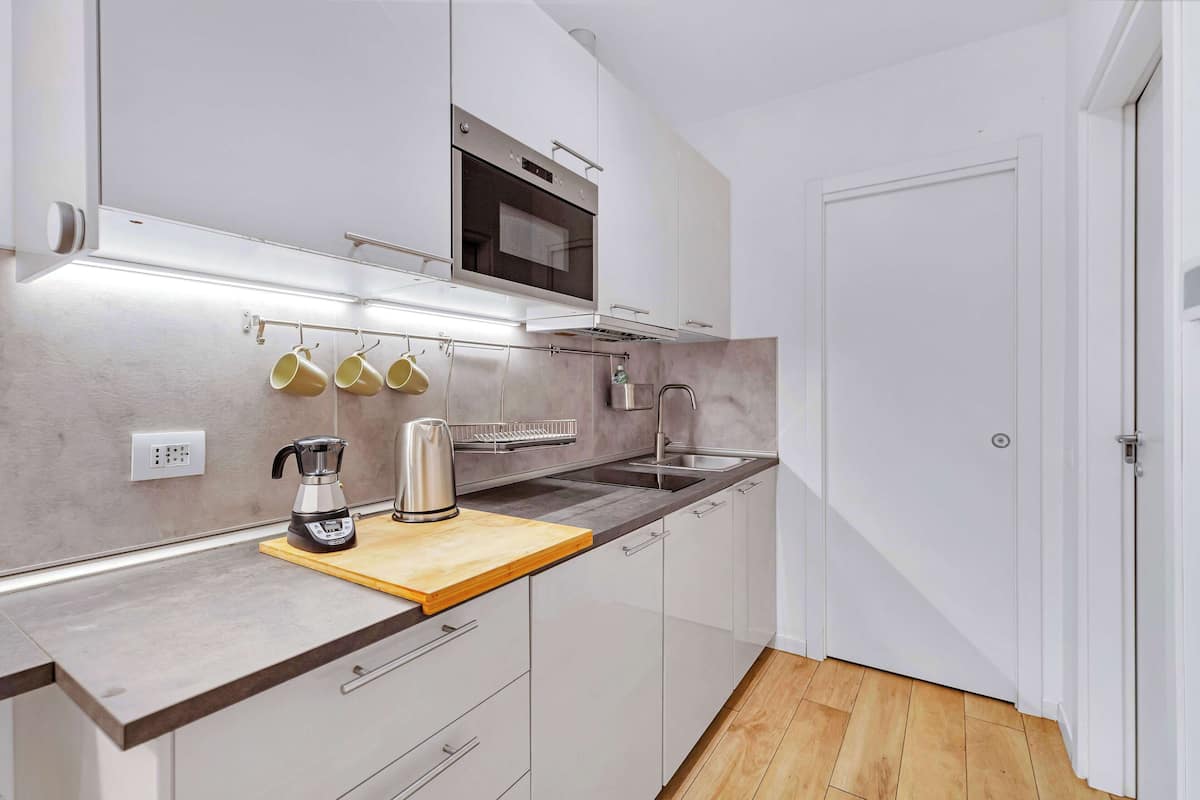 Familie appartement | Privékeuken | Een koelkast, een kookplaat, een vaatwasser, een espressoapparaat