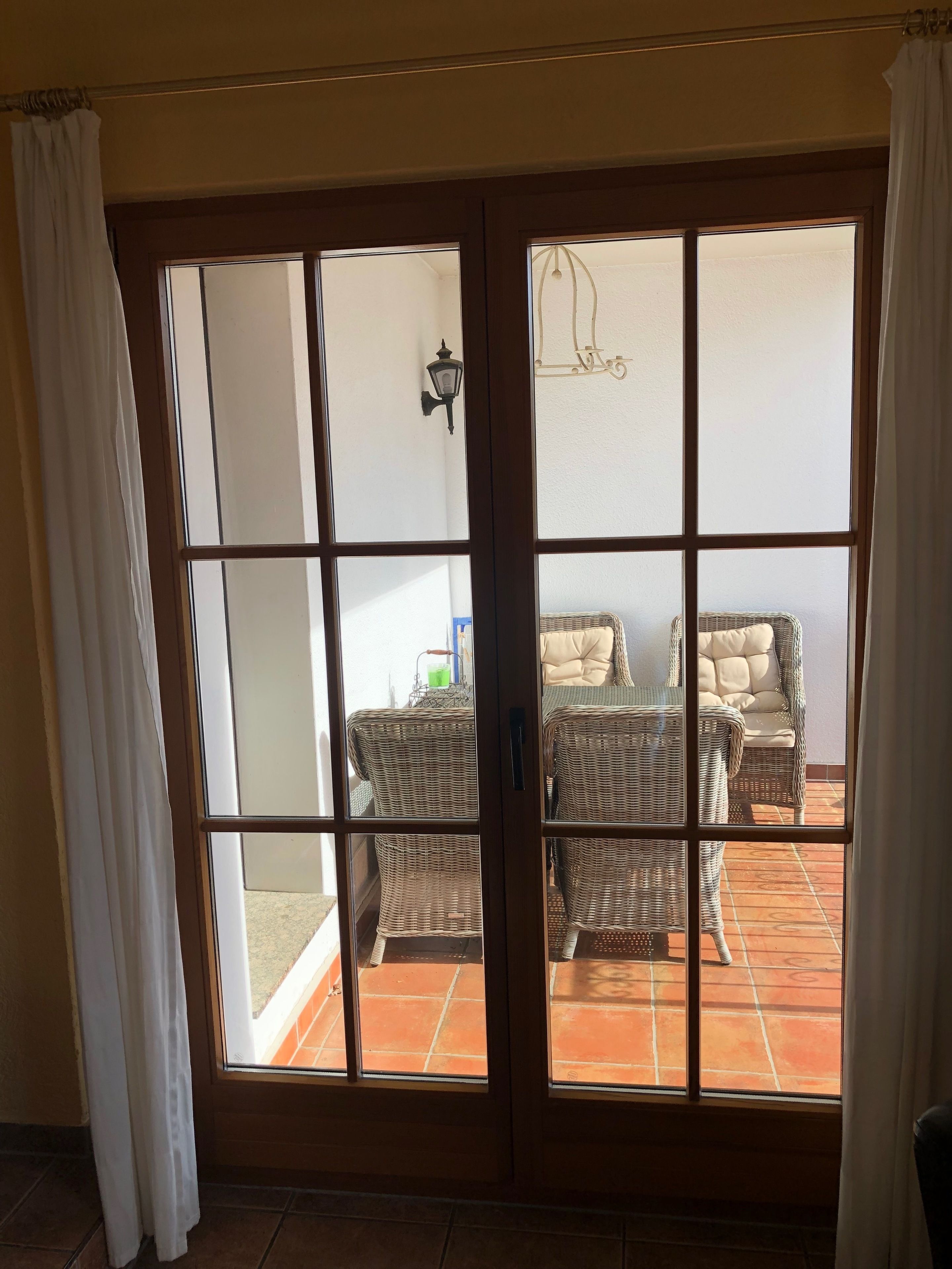 A room with a sliding glass door leading to an outdoor patio area.