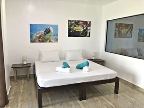 Habitación Deluxe, vistas al mar | Minibar, sistema de insonorización, wifi gratis y ropa de cama