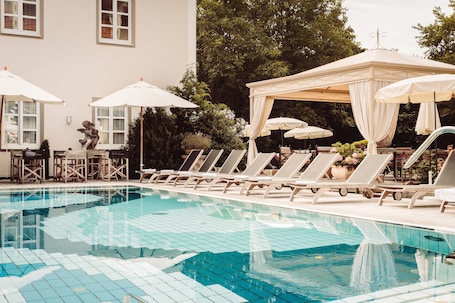 Indoor pool, outdoor pool, open 7:00 AM to 10:00 PM, pool umbrellas