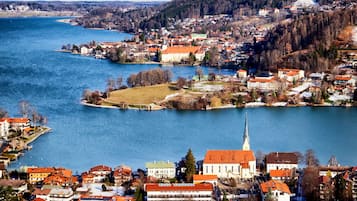 A riverside town with a prominent church and residential buildings along the water.