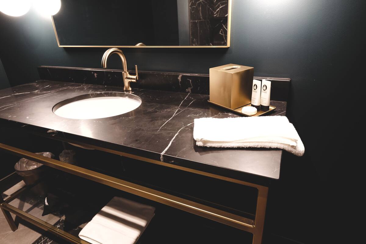 designer toiletries, hair dryer, towels