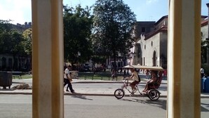 A public square with a central open area, surrounded by buildings with classical architecture. - B&B El Leon Azul Habana Vieja (Havana)
