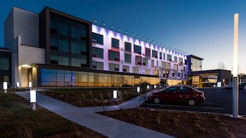 Contemporary building with a striking pattern of rectangular windows and clean lines.