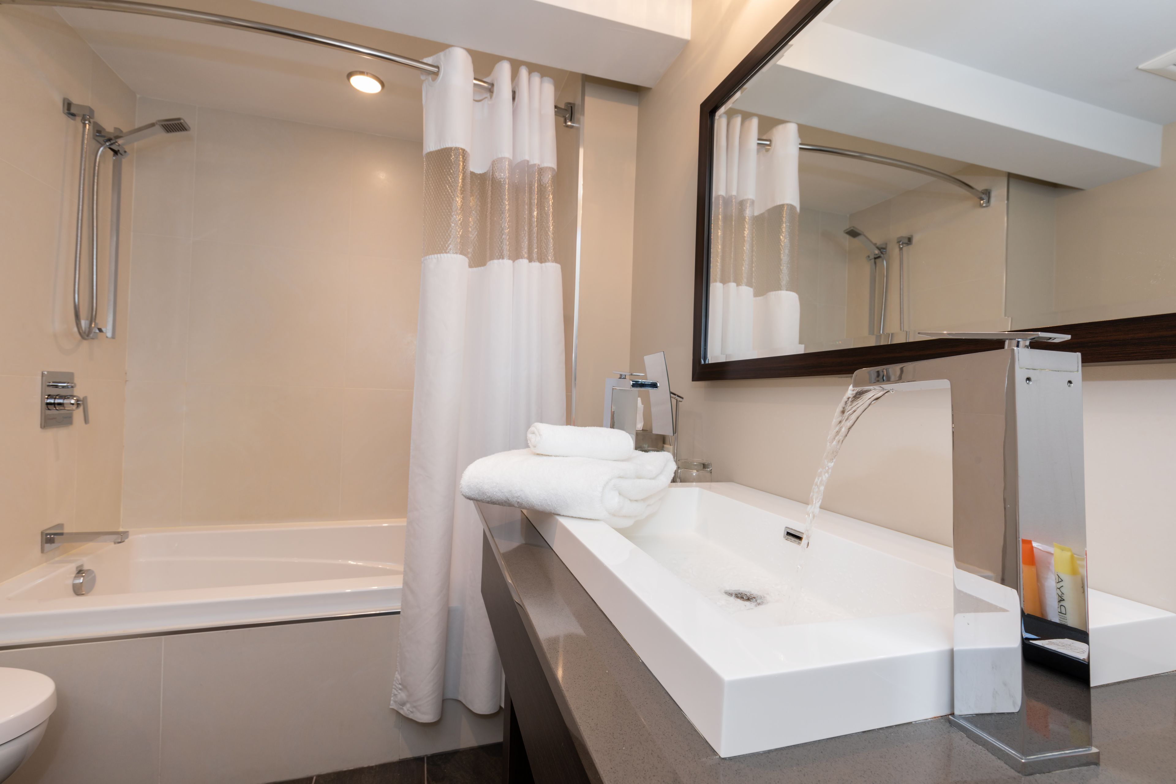 comfort suite, 1 king bed | bathroom | free toiletries, hair dryer, towels
