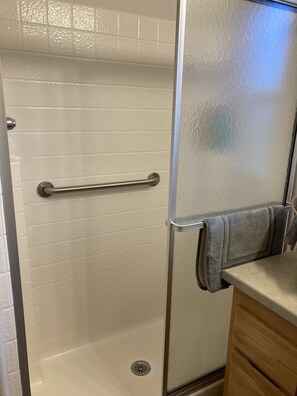 Combined shower/tub, hair dryer, towels, soap