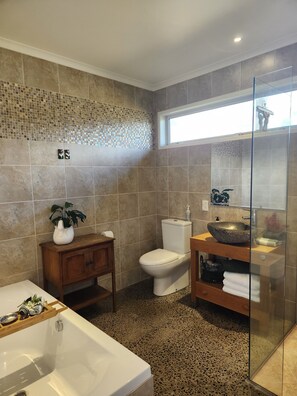 Bathtub, hair dryer, towels, soap