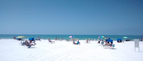 On the beach, sun loungers, beach towels