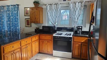 Fridge, microwave, stovetop, coffee/tea maker