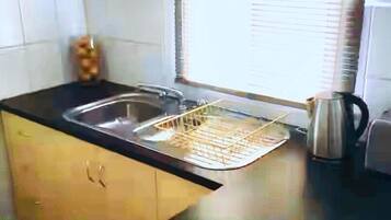 Fridge, microwave, electric kettle, toaster