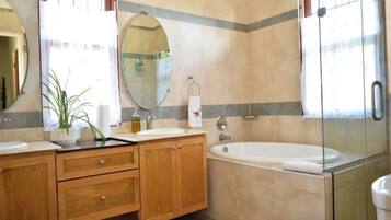 Combined shower/tub, hair dryer, towels, soap