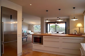 Kitchen looking to the dining area and lounge.