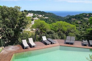 Partial view of the pool from the outdoor terrace with old town and sea views.