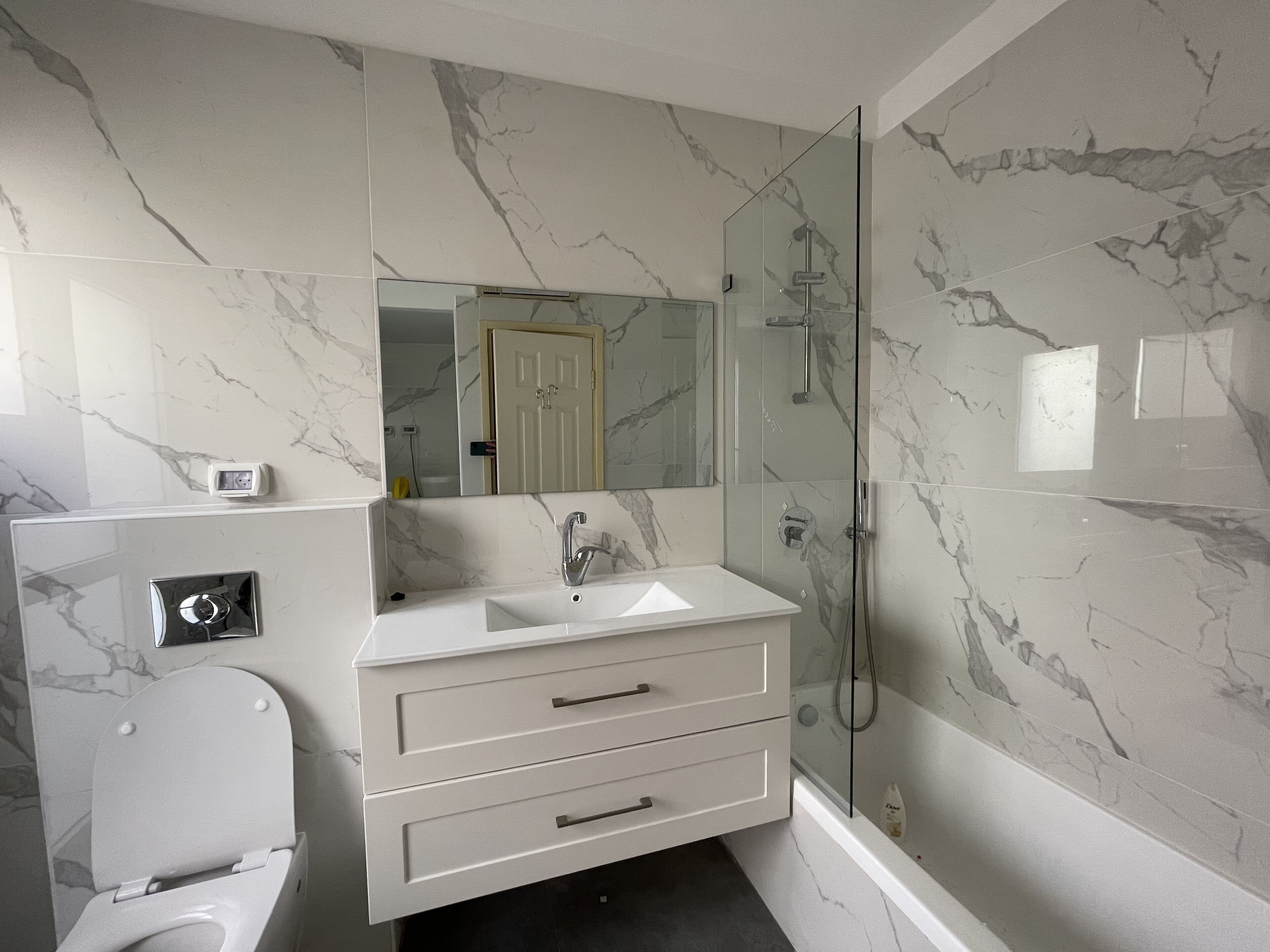 Combined shower/tub, hair dryer