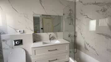 Combined shower/tub, hair dryer