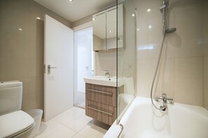 Combined shower/tub, hair dryer, towels, soap