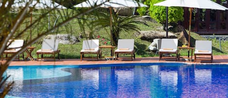 Outdoor pool, open 6:00 AM to 10:00 PM, free pool cabanas