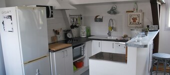 the attic of Orange.  Appart in old house 20 m from the pedestrian street