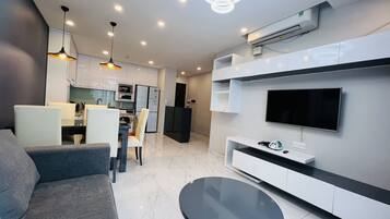 Design Apartment, 3 Bedrooms | Living area | 52-inch flat-screen TV with cable channels, TV