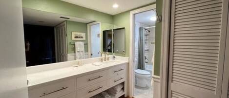 Combined shower/tub, hair dryer, towels, soap