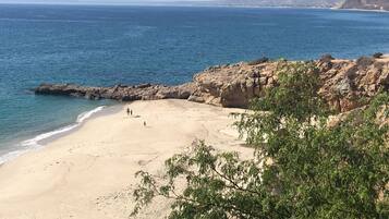 On the beach, sun-loungers, beach towels