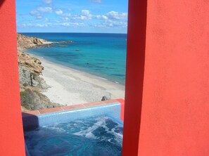 On the beach, sun loungers, beach towels