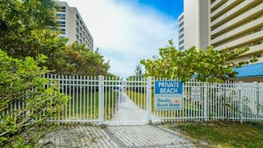A gated entrance to a private beach area, with a sign indicating it is for the exclusive use of Siesta Beach House Condominium Association. - Condo with Private Beach Access, Great Shared Amenities - Private Beach House (Siesta Key)