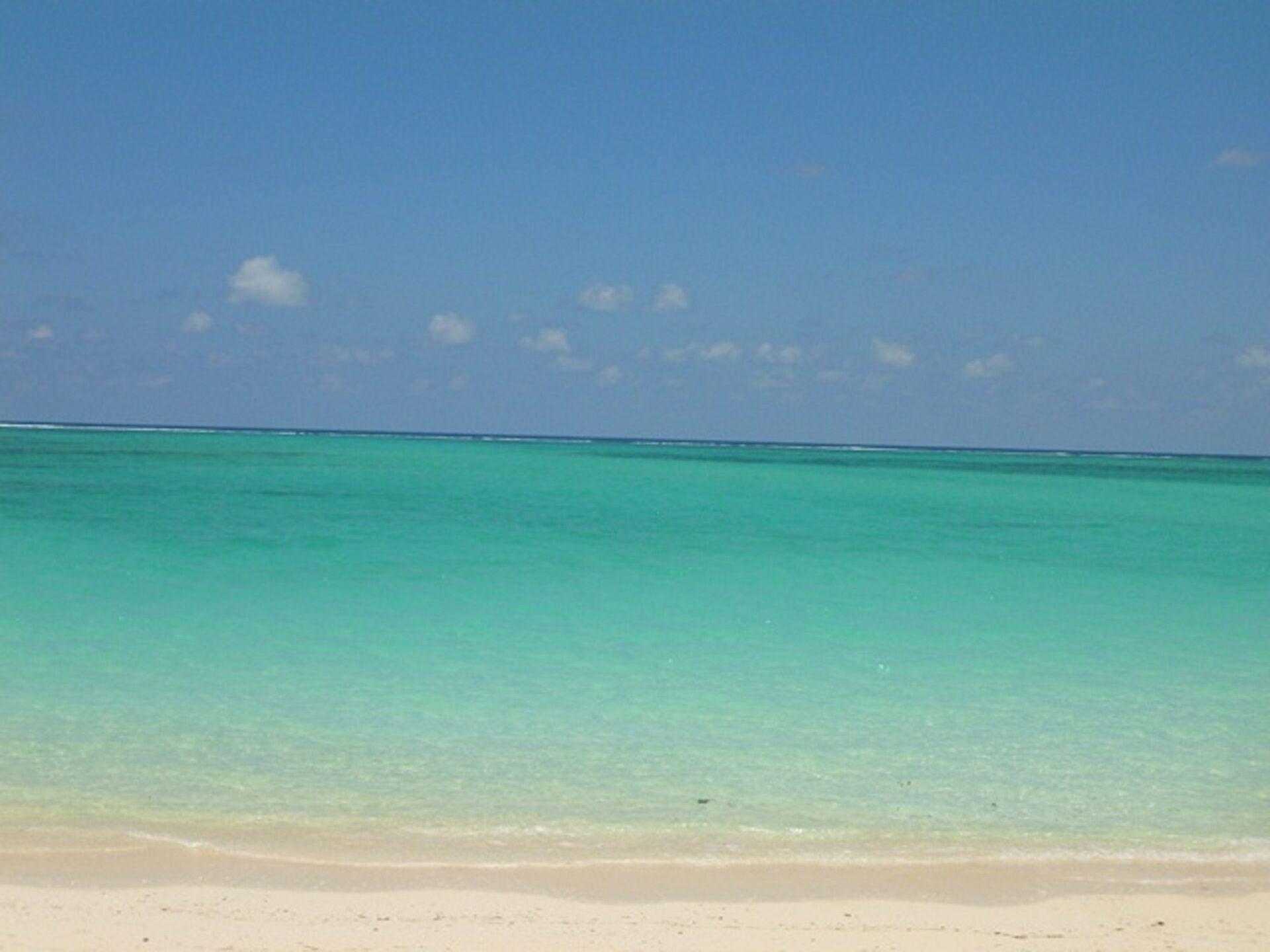 On the beach, sun loungers, beach towels