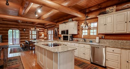 Secluded waterfront log cabin with game room, dock, fire pit & deck