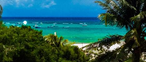 On the beach, sun loungers, beach towels