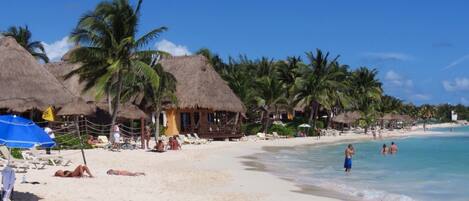 On the beach, sun-loungers, beach towels
