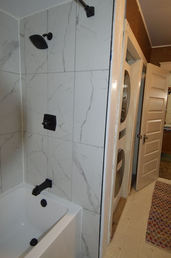 Combined shower/tub, hair dryer, towels, soap