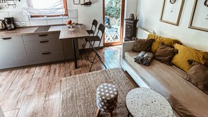 A compact living space with a kitchen, dining area, and seating area. - a place where stress doesn't exist  (Grižane)