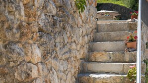 A stone staircase with potted plants at each step. - a place where stress doesn't exist  (Grižane)