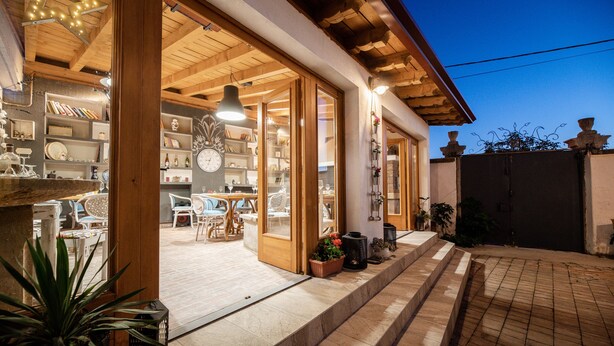 A well-lit outdoor area with a wooden pergola, a pool, and a variety of seating arrangements. - a place where stress doesn't exist  (Grižane)