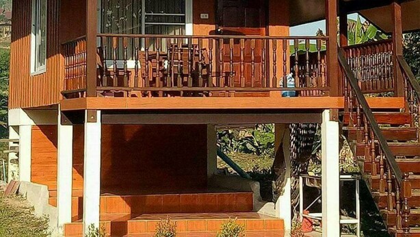 A wooden cabin with a balcony, a staircase, and a sign indicating it is a restaurant. - Rai Monsicha Khaokho (Khao Kho)