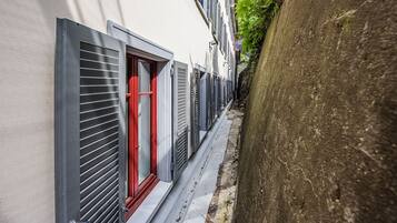 Stroll through this charming alleyway lined with historic buildings.