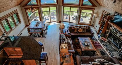 Lakefront lodge with private dock, firepit, deck & sunset views