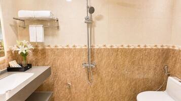 Shower, free toiletries, hair dryer, slippers