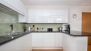 Stovetop, dishwasher, cookware/dishes/utensils - 301 Riverview Apartment (Inverness)